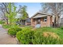 A charming home with well-maintained lawn and landscaping, offering curb appeal and a welcoming atmosphere at 2731 S Logan St, Englewood, CO 80113