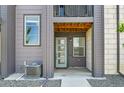Charming townhome entrance featuring a stylish door with glass inserts and a welcoming covered porch at 1575 W 68Th Ave, Denver, CO 80221