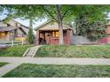 Charming brick home featuring a cozy front porch and manicured lawn, perfect for relaxation at 1866 S Pennsylvania St, Denver, CO 80210