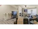 Cozy living room with a fireplace, plush seating, and contemporary decor for a welcoming ambiance at 1404 Whitehall Dr # C, Longmont, CO 80504