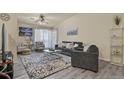 Comfortable living room featuring stylish decor, modern furniture, and ample natural light at 1404 Whitehall Dr # C, Longmont, CO 80504