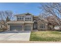 Beautiful two-story home with brick and siding, features a large front lawn and a three-car garage at 3343 W 109Th Cir, Westminster, CO 80031