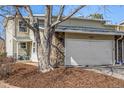 Charming home with a two car garage, rock facade, mature trees, and a cozy front porch at 2650 S Vaughn Way # D, Aurora, CO 80014