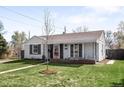 Well-maintained home with fresh landscaping and a welcoming front entrance at 1380 Roslyn St, Denver, CO 80220