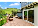 Relaxing deck with outdoor furniture and mountain views, accessed through a sliding glass door at 18967 W 54Th Ln, Golden, CO 80403