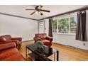 Cozy living room with hardwood floors, natural light, and comfortable seating at 609 S Quentin St, Aurora, CO 80012