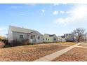 Houses on a residential street with grassy yards at 3230 S Bannock St, Englewood, CO 80110