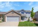 Attractive two-story home with a brick-accented garage and inviting curb appeal at 19075 E Grand Cir, Aurora, CO 80015