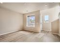 Inviting living area with large window and natural light at 6817 Huddersfield Ln, Castle Pines, CO 80108