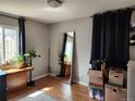 Bright bedroom with large mirror and ample natural light at 985 Xavier St, Denver, CO 80204