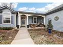 Inviting front porch with stylish seating area and landscaped garden at 4644 W 112Th Ct, Westminster, CO 80031