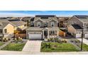 Expansive aerial view showcasing the home, surrounding neighborhood, and well-maintained landscaping at 16308 Saint Paul St, Thornton, CO 80602
