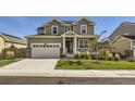 Two story home featuring a manicured lawn and a two car garage at 16308 Saint Paul St, Thornton, CO 80602