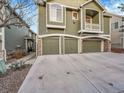 Street view of well maintained two-story home with three car garage at 1358 Carlyle Park Cir, Highlands Ranch, CO 80129