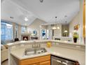 Kitchen with double sink and stainless steel dishwasher at 1358 Carlyle Park Cir, Highlands Ranch, CO 80129