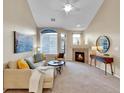 Spacious living room with fireplace and vaulted ceiling at 1358 Carlyle Park Cir, Highlands Ranch, CO 80129