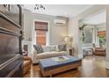 Bright living room with hardwood floors, comfortable seating, and charming architectural details at 1176 Gaylord St # 101, Denver, CO 80206