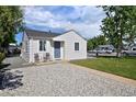 Attractive single-story home with a rock lawn, complemented by a well-kept lawn at 5525 Pierce Ct, Arvada, CO 80002