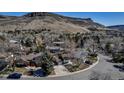 Stunning aerial view of neighborhood homes with mountainous backdrop on a sunny day at 1003 N Jackson St, Golden, CO 80403