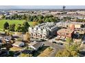 Aerial shot showcasing a modern townhome community near a park, with easy access to urban amenities and green spaces at 7035 E 38Th Ave # 4, Denver, CO 80207