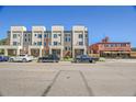 Modern townhomes with sleek design, neutral tones, and convenient street parking, adjacent to local brewery at 7035 E 38Th Ave # 4, Denver, CO 80207