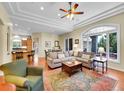 Bright and airy living room with hardwood floors, a large window, and comfortable seating at 4704 W Hinsdale Ct, Littleton, CO 80128