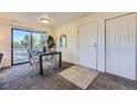 Bright dining area with a modern table set, sliding glass doors, and seamless access to the adjacent living spaces at 5995 W Hampden Ave # 17F, Denver, CO 80227