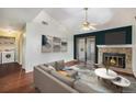 Inviting living room featuring a fireplace, hardwood floors, neutral walls, and sliding glass doors to the outside at 4681 S Decatur St # 327, Englewood, CO 80110