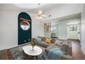 A comfortable living room area with vaulted ceilings, neutral walls, modern decor, and convenient access to other rooms at 4681 S Decatur St # 327, Englewood, CO 80110