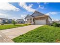 Exterior showcasing well-maintained lawn, long driveway, and charming facade, perfect for suburban living at 42400 Forest Oaks Dr, Elizabeth, CO 80107
