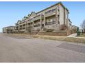 Multi-level townhouse complex showcasing architectural design and a desirable neighborhood setting at 11250 Florence St # 20B, Commerce City, CO 80640