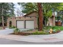 A beige brick facade and an arched walkway to the front door lend this home a touch of elegance at 8793 E Monmouth Pl, Denver, CO 80237