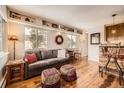 Cozy living room featuring hardwood floors, comfortable seating, and plenty of natural light at 1941 Boreas Pass Rd # 1C, Breckenridge, CO 80424