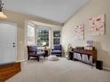 Cozy living room featuring large windows, comfortable seating, and stylish decor at 1234 Riddlewood Ln, Highlands Ranch, CO 80129