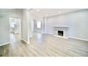 Bright living room featuring hardwood floors and a fireplace at 436 Cherokee St, Denver, CO 80204
