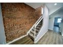 Modern staircase with exposed brick wall at 436 Cherokee St, Denver, CO 80204