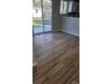 Spacious area with hardwood floors, and a sliding glass door out to the yard at 5956 S Winnipeg St, Aurora, CO 80015