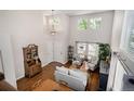 Bright living room with high ceilings, lots of natural light, and hardwood floors at 735 Poppy Pl, Highlands Ranch, CO 80129