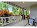 Spacious porch with comfortable seating and views of lush greenery at 13025 Umatilla Ct, Denver, CO 80234