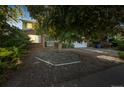 Charming home boasts mature trees and natural landscaping, adding to its curb appeal at 4474 S Vrain St, Denver, CO 80236