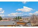 Scenic view of rolling mountains under a blue sky with puffy white clouds over the neighborhood at 13232 W Jewell Cir, Lakewood, CO 80228