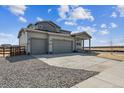 Charming two-story home featuring a three car garage and covered front porch at 14366 Heritage Dr, Mead, CO 80504