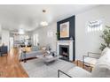Inviting living room with fireplace, hardwood floors, and modern decor at 2649 N High St, Denver, CO 80205