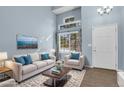 Comfortable living room with large window, modern furniture, and beautiful decor at 5521 S Yakima St, Aurora, CO 80015