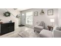 Inviting living room with neutral tones, accent furniture, and stylish decor for a cozy atmosphere at 6450 Tennyson St # 1, Arvada, CO 80003