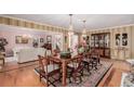 Open concept dining room with hardwood floors and view to living room at 2209 Green Oaks Ln, Greenwood Village, CO 80121
