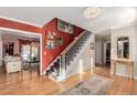 Bright and spacious entryway with hardwood floors and elegant staircase at 2209 Green Oaks Ln, Greenwood Village, CO 80121