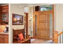 Warm, inviting foyer featuring beautiful wood accents and ample natural light at 20050 Lost Arrowhead Dr, Monument, CO 80132