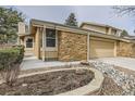 Charming two-story home features a two-car garage, and well-maintained front yard landscaping at 8543 Redstone St, Highlands Ranch, CO 80126