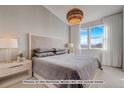 Spacious bedroom with plush bedding, large windows, and mountain views at 2732 W 68Th Ave, Denver, CO 80221
